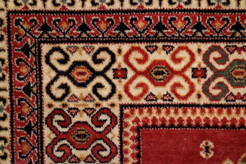 58295564 - geometric  pattern old persian carpet closeup