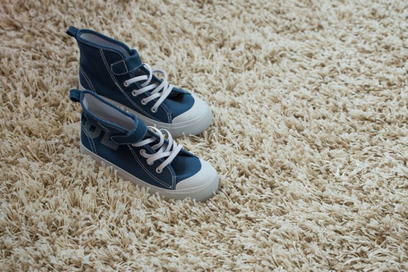 52595283 - shoes kid on the carpet