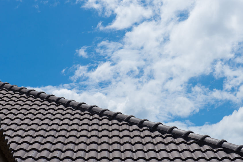 43817852 - roof on a new house with blue sky